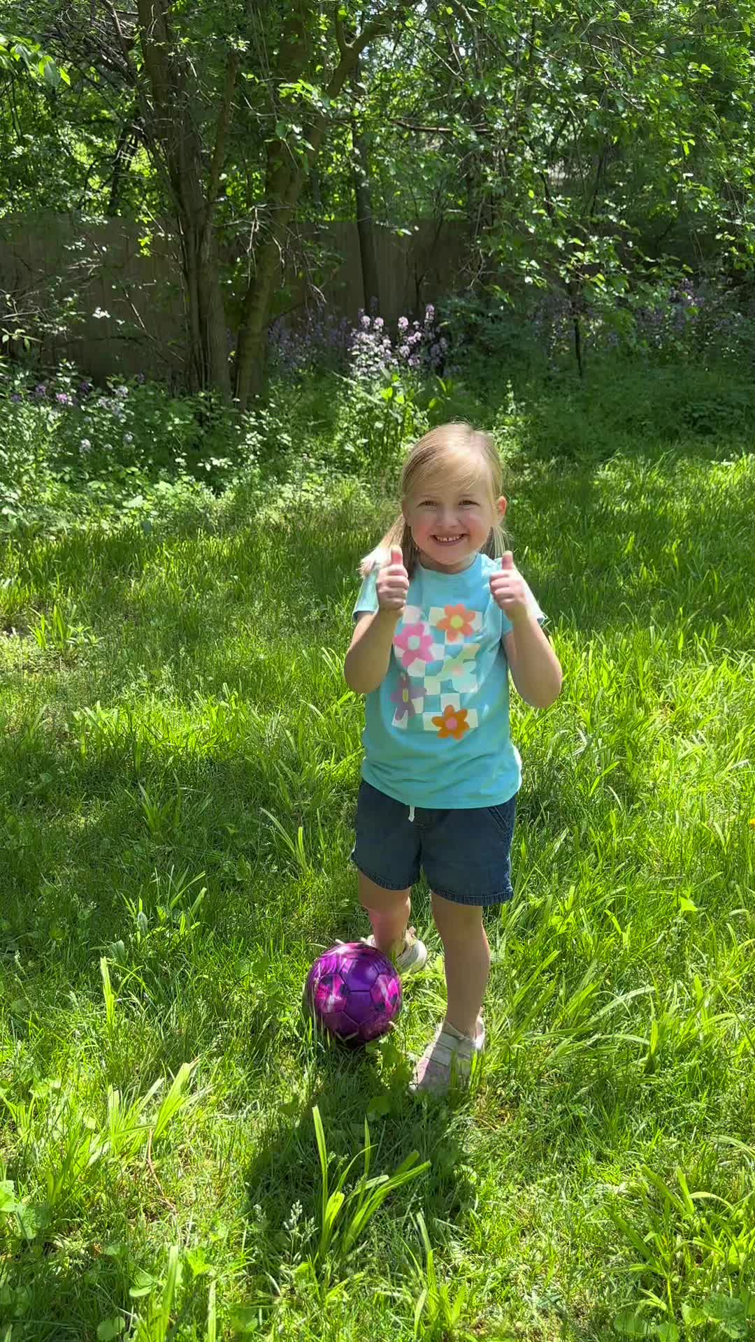 Child giving thumbs up